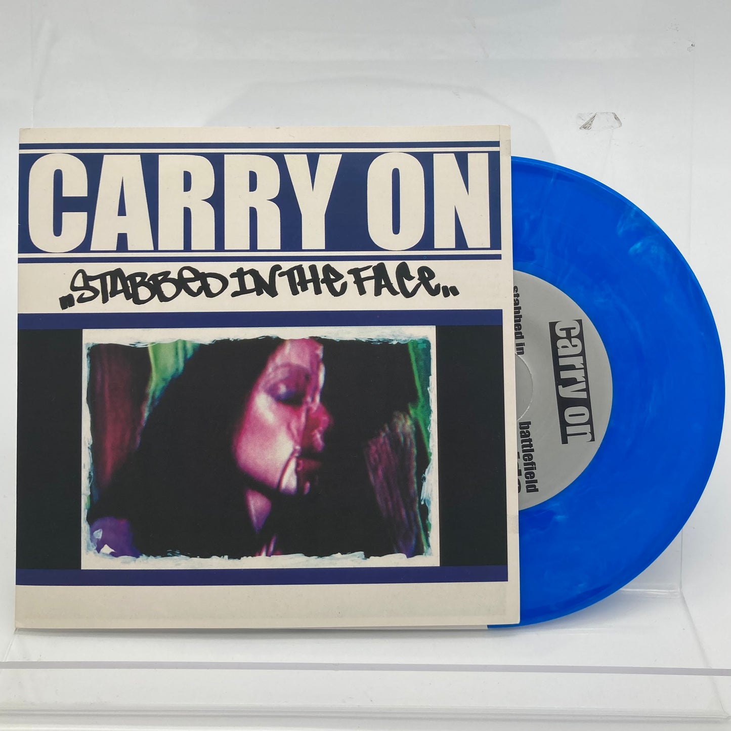 CARRY ON • Stabbed In The Face (Blue Marbled) • 7" • Second Hand